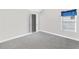 Bedroom with neutral walls, window, and carpet at 2466 Bear Mountain St, Lithonia, GA 30058