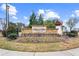 Mason's Mill Estates entrance sign amidst colorful flowerbeds and manicured landscaping at 2466 Bear Mountain St, Lithonia, GA 30058