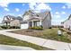 Charming two-story home with a two-car garage, a covered porch, and manicured front yard at 2466 Bear Mountain St, Lithonia, GA 30058
