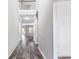 Elegant home foyer featuring soaring ceilings, beautiful hardwood floors, and a view into the spacious living area at 2466 Bear Mountain St, Lithonia, GA 30058