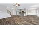 Open floor plan showcasing hardwood floors, a modern kitchen, and ample living space at 2466 Bear Mountain St, Lithonia, GA 30058