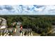 An aerial view of townhomes surrounded by green trees and includes a community pool at 258 Ridge Mill Dr, Acworth, GA 30102