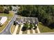 An aerial view showing the townhomes, parking, landscaping and community pool at 258 Ridge Mill Dr, Acworth, GA 30102