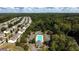 An aerial view of a community pool with lounge chairs surrounded by townhomes at 258 Ridge Mill Dr, Acworth, GA 30102