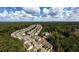 Overhead image of the neighborhood with a distant pool surrounded by green trees at 258 Ridge Mill Dr, Acworth, GA 30102