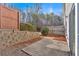 This backyard patio includes a stone retaining wall and wooden fence providing a relaxing outdoor space at 258 Ridge Mill Dr, Acworth, GA 30102