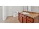 Bathroom featuring a vanity with a sink, a toilet, and an adjacent doorway with tiled floors at 258 Ridge Mill Dr, Acworth, GA 30102
