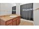 A bathroom showcasing a vanity with ample cabinet space and a shower or tub with a dark curtain at 258 Ridge Mill Dr, Acworth, GA 30102