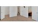 A spacious bedroom with hardwood floors and three doorways showcasing an open and connected layout at 258 Ridge Mill Dr, Acworth, GA 30102