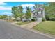 A peaceful street view showcasing well-kept townhouses with lush green lawns and driveways at 258 Ridge Mill Dr, Acworth, GA 30102