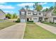 A well-manicured lawn highlights this lovely townhouse community with driveways and sidewalks at 258 Ridge Mill Dr, Acworth, GA 30102