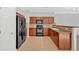 Well-equipped kitchen features wooden cabinets, black appliances, and tile flooring for style and functionality at 258 Ridge Mill Dr, Acworth, GA 30102