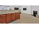 Beautiful view from kitchen to living room, featuring wooden cabinets, tile backsplash, and modern appliances at 258 Ridge Mill Dr, Acworth, GA 30102