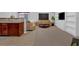 Open concept living area with carpet, updated kitchen and access to dining and living space at 258 Ridge Mill Dr, Acworth, GA 30102