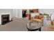 Open-concept living area with a fireplace, seamlessly connecting to the kitchen and dining space at 258 Ridge Mill Dr, Acworth, GA 30102