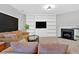 Inviting living room with built-in shelving, fireplace, and neutral decor, perfect for relaxing and entertaining at 258 Ridge Mill Dr, Acworth, GA 30102