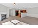 Spacious living room with hardwood floors, fireplace, and seamlessly connected kitchen area at 258 Ridge Mill Dr, Acworth, GA 30102