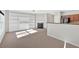 Inviting living room featuring a fireplace, built-in shelving, and an open flow to the kitchen at 258 Ridge Mill Dr, Acworth, GA 30102