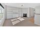 Bright living room with a cozy fireplace and built-in shelving for storage and display at 258 Ridge Mill Dr, Acworth, GA 30102
