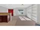 Open living room featuring built-in bookshelves and large window allowing for abundant natural light at 258 Ridge Mill Dr, Acworth, GA 30102