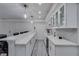 Elegant wet bar with white cabinetry and ample counter space for entertaining at 3570 Mill Creek Drive Sw Dr, Smyrna, GA 30082