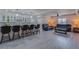 Finished basement featuring a wet bar with white cabinets, bar seating and comfortable seating area at 3570 Mill Creek Drive Sw Dr, Smyrna, GA 30082