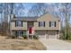 Attractive split-level home with a two-car garage and well-maintained lawn at 3570 Mill Creek Drive Sw Dr, Smyrna, GA 30082