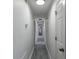 Clean hallway with recessed lighting and doors leading to various rooms at 3570 Mill Creek Drive Sw Dr, Smyrna, GA 30082