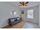 Cozy living room featuring a black futon and a round mirror at 3570 Mill Creek Drive Sw Dr, Smyrna, GA 30082