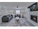 Comfortable living room featuring a fireplace and soft, neutral tones at 3570 Mill Creek Drive Sw Dr, Smyrna, GA 30082