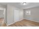 Bright bedroom with wood-look flooring and a closet; neutral setting at 7323 Howard Pl, Jonesboro, GA 30236