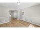 A bright dining area featuring neutral-colored walls and light wood flooring at 7323 Howard Pl, Jonesboro, GA 30236