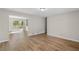 Bright living room with modern wood flooring and sliding door to deck at 7323 Howard Pl, Jonesboro, GA 30236