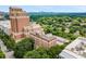 Beautiful aerial view showcasing the building among lush green trees with the city skyline at 1325 Peachtree Ne St # 402, Atlanta, GA 30309