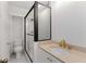 Modern bathroom featuring a sleek glass shower and elegant gold faucet at 1325 Peachtree Ne St # 402, Atlanta, GA 30309