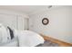 Bedroom with a large closet, wood floors, neutral walls, and a circular mirror at 1325 Peachtree Ne St # 402, Atlanta, GA 30309