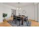 Modern dining room with a wooden table, seating for six, and stylish light fixture at 1325 Peachtree Ne St # 402, Atlanta, GA 30309