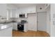 Bright kitchen features white cabinetry, stainless appliances, and natural light at 1325 Peachtree Ne St # 402, Atlanta, GA 30309
