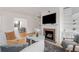 Cozy living room featuring a fireplace, comfortable seating, and hardwood floors at 1325 Peachtree Ne St # 402, Atlanta, GA 30309