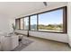 Bright living room with large windows offering scenic views, modern decor, and comfortable seating at 1325 Peachtree Ne St # 402, Atlanta, GA 30309