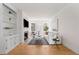 Well-lit living room featuring a fireplace, built-in shelving, and hardwood floors at 1325 Peachtree Ne St # 402, Atlanta, GA 30309