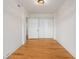 Neutral room featuring hardwood floors and a light fixture at 1325 Peachtree Ne St # 402, Atlanta, GA 30309
