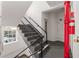 Stairway with black metal railing and red fire extinguisher at 1325 Peachtree Ne St # 402, Atlanta, GA 30309