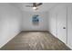 Bedroom featuring tan carpet, ceiling fan and a window at 4933 Bayside Ct, Stone Mountain, GA 30088