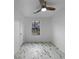 This bedroom features vinyl floors, a ceiling fan and a window at 4933 Bayside Ct, Stone Mountain, GA 30088
