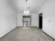 A chandelier-lit dining room with sliding doors leading to the backyard at 4933 Bayside Ct, Stone Mountain, GA 30088