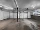 Spacious two-car garage featuring ample storage space and two white garage doors at 4933 Bayside Ct, Stone Mountain, GA 30088
