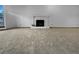 Spacious living room featuring neutral colors, fireplace, and carpeted floors at 4933 Bayside Ct, Stone Mountain, GA 30088