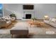 Sun-filled living room with elegant fireplace and comfortable seating at 4933 Bayside Ct, Stone Mountain, GA 30088