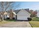 Charming single-Gathering home features a brick accent wall, 2-car garage, and a well-manicured front lawn at 1128 Strath Clyde Way, Mcdonough, GA 30253